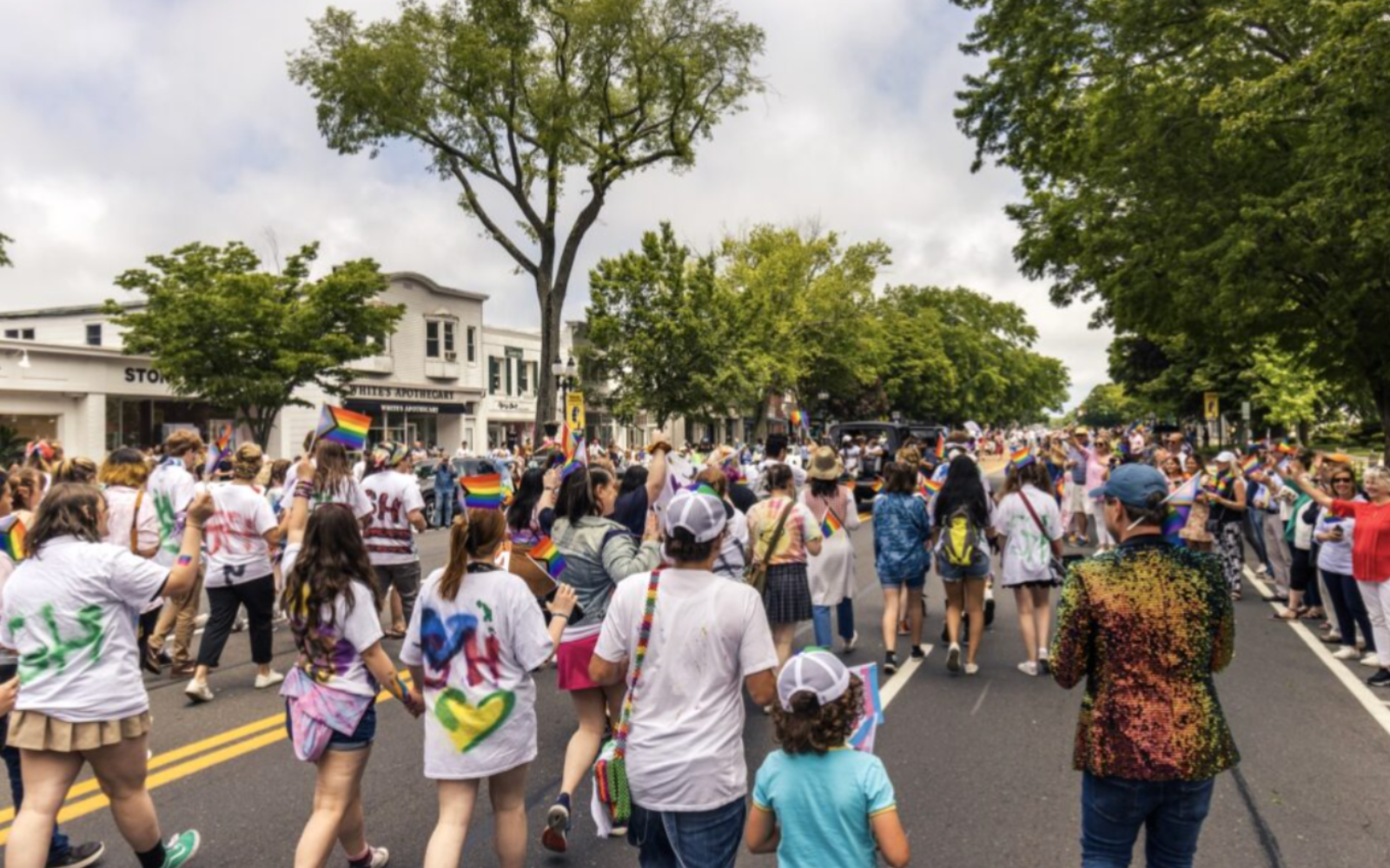 photo of a crowd marching through the streets of East Hampton during the First Annual Hamptons Pride Parade in 2022